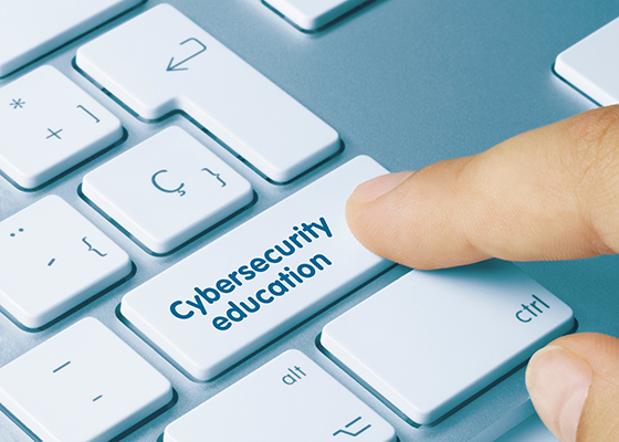 Cybersecurity education inscribed on a keyboard.